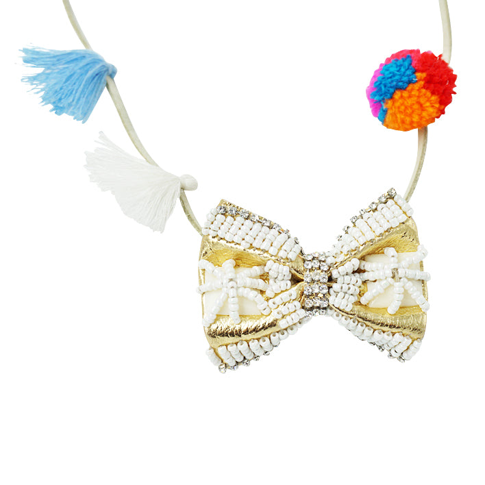 SAND BY SAYA N.Y. - Gold & Pearl Bow - Pom Pom Kids Necklace - Embroidered Motifs - 1 COLOR -