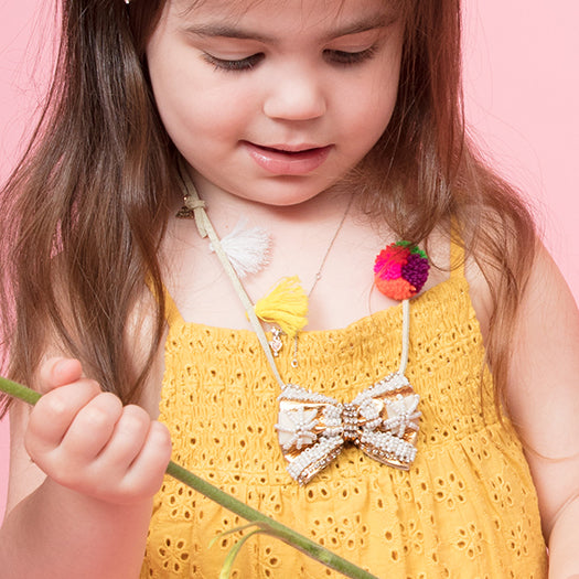 SAND BY SAYA N.Y. - Gold & Pearl Bow - Pom Pom Kids Necklace - Embroidered Motifs - 1 COLOR -